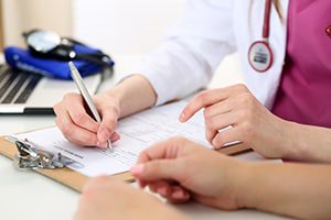 Clinical trial doctor writing an