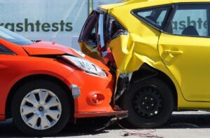 A close-up of a rear-end collision between cars involved in a Florida car crash test