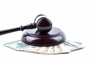 Zantac lawsuit settlement money and a gavel